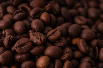 Naklejka premium AI generated illustration of A heap of freshly roasted coffee beans