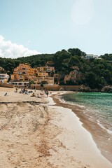 Group of happy people enjoying a sunny day on the beach in Mallorca, Spain
