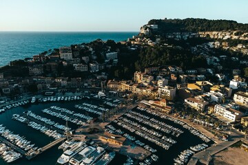 Aerial view of boats in the harbor in Mallorca, Spain with the city in the background