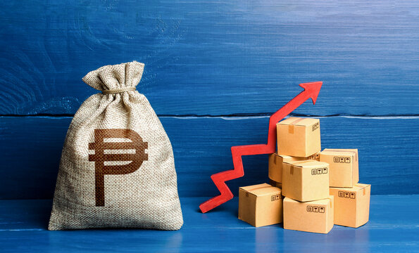 Philippine peso money bag with boxes and up arrow. Income increase, acceleration and growing of economy. High sales. Production rise. Good consumer sentiment and demand for goods. Growing prices