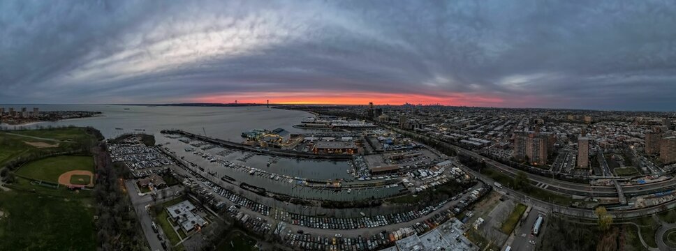 Aerial view over the industrial area on the shores of Gravesend Bay, at sunset in Brooklyn, New York