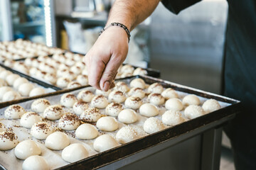 unrecognizable man cooking buns. Traditional Italian cuisine