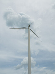 wind turbine Innovation for clean energy. tracking shot of energy producing wind turbines in a field a rural area. wind electricity generator in summer fields, power plant, wind efficiency