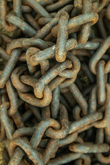 Rusty chain on the ground, close up of photo.