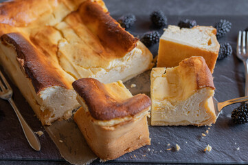 German cheesecake on dark table background