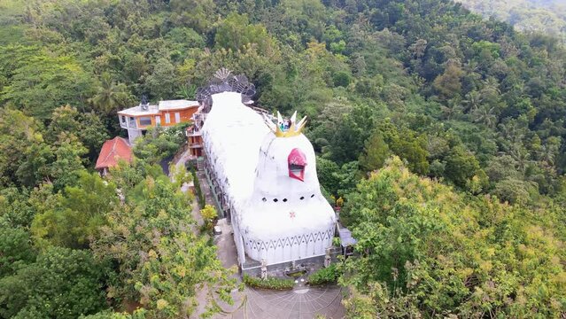 Unusual church in forest landscape. aerial orbit. Magelang, Indonesia