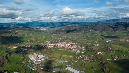 Naklejka premium Aerial view of village houses in the mountainous valleys of Basque Country