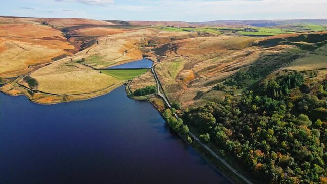 Cinematic, aerial clip of Ogden Reservoir, Oldham, on the edge of the Pennines.