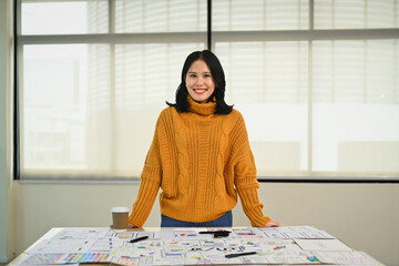 Portrait of web developer woman working on app design and user interface at workstation