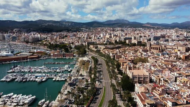 Landscape aerial view of capital city of Mallorca with many yachts and ships in city port marina