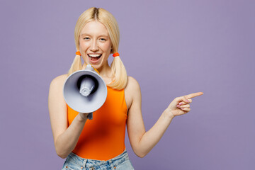 Young blonde woman she wear orange tank shirt casual clothes hold in hand megaphone scream...