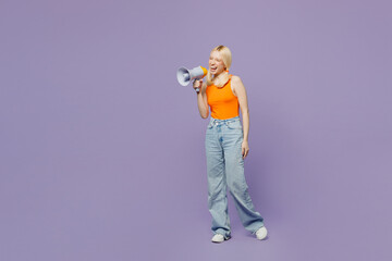 Full body young blonde woman wear orange tank shirt casual clothes hold in hand megaphone scream announces discounts sale Hurry up isolated on plain pastel light purple background. Lifestyle concept.