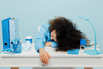 Young tired sad exhausted weary employee business woman wear casual shirt sit working at white...