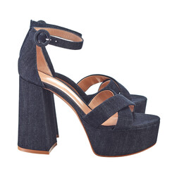 Elegant summer women's sandals made of indigo denim, with criss-cross straps, with ankle fixation, on a high massive heel, standing out against a white background. Side view. - 618109450