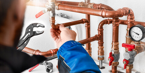 Plumbing concept or service water worker. copper pipeline with preassure gauge. - obrazy, fototapety, plakaty
