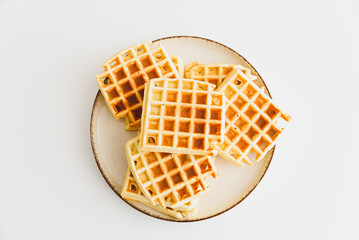 Belgian waffles on white table. top view