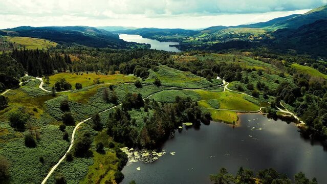 Tarn Hows in the Lake District National Park in North West England, It contains a picturesque tarn, Lake in dense woodland