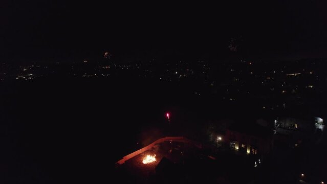 Aerial, cinematic drone footage of Fireworks on bonfire night in the UK.