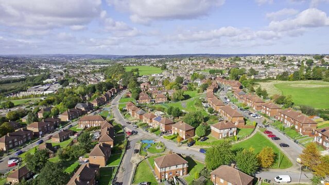 Aerial View of a typical UK town, suburb district sowing housing, gardens and roads.