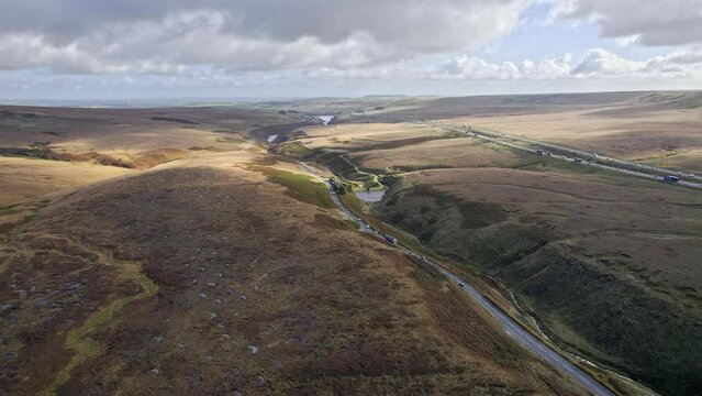 Aerial drone, cinematic footage of a country winding road on Saddleworth Moor