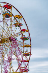 amazing blue sky on fun fair. Panorama view Ferris wheel in amusement park. 