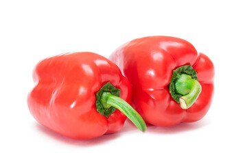 Two Fresh Red Sweet Bell Peppers Isolated on White Background