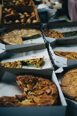 Many pieces of delicious diferent pies in a boxes. Food market