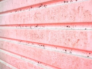 Grunge soft pink horizontal panelled background with space for copy