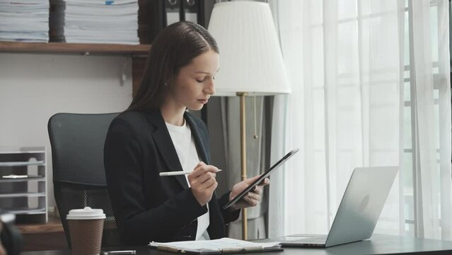 Young business woman lawyer works in office, bookkeeping, audit, stock split, accounting valuation, business combination, marginal deposit, trade account payable, hire purchase, balance sheet account