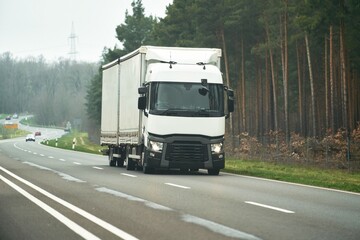 Fototapeta na wymiar European Logistics. Journey Through Highways, Modern Trucks Conquer Roadways and Deliver Goods