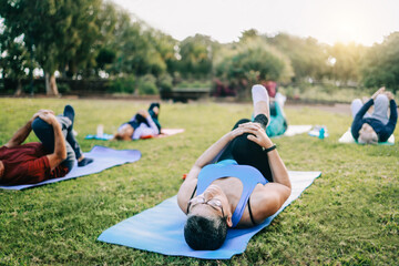 Senior sport people exercising during yoga workout class outdoor at park city - Fitness joyful...