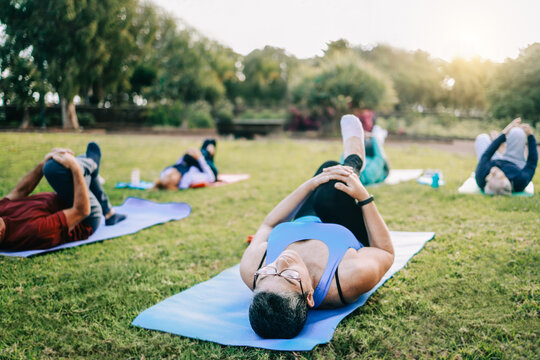 Senior Sport People Exercising During Yoga Workout Class Outdoor At Park City - Fitness Joyful Elderly Lifestyle