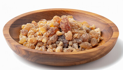 Frankincense resin in wooden bowl, isolated on white background. Pile of natural frankincense...