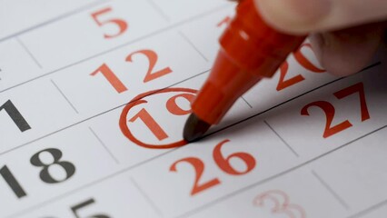 The nineteenth number in the calendar is marked with a bold red marker as an important date. Close-up.