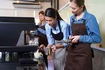 Group young woman people leaning and education workshop for classes barista coffee in cafe room. ...