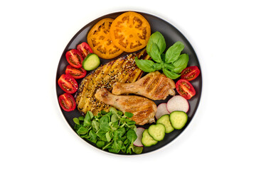 Grilled chicken with vegetables, isolated on white background.