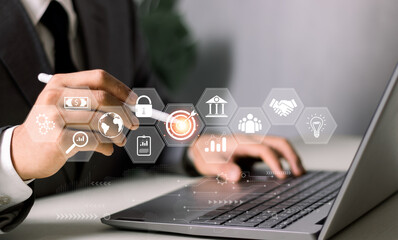 businessman pointing to target icon Concepts of long-term business development and management.Setting goals for business success. problem solving, workflow,optimal business operations and innovation.
