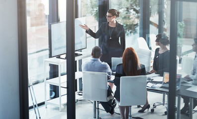 Coaching, monitor or business people in presentation for sales report, vision or data analysis in training. Leadership, businesswoman teaching or manager planning strategy on screen in group meeting
