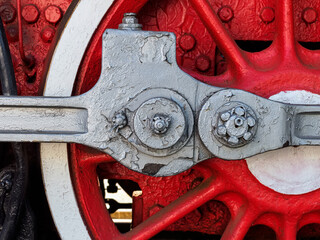 red wheel of an old steam locomotive close-up