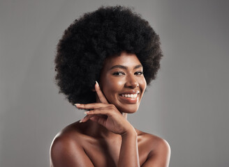 Beauty, skincare and portrait of happy woman with afro, cosmetics and dermatology on grey background. Natural skin care, studio and African model with smile on face, salon makeup glow and wellness.