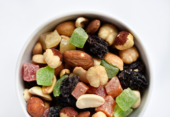 Nut mixture in a cup. A delicious snack of nuts and dried fruits.