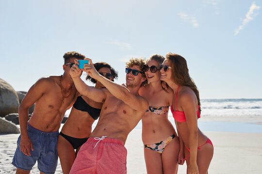Selfie, beach and group of friends for summer, holiday and vacation in bikini, social media post and content creation. Happy young people or men and women in profile picture or digital memory at sea