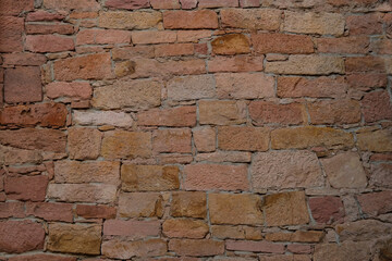 beautiful vintage texture of wall of medieval castle built in middle 17th century, brown volumetric clay bricks for designer, wallpaper, empty background, part of ancient building, monastery, temple