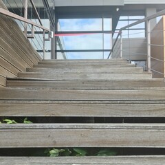 A wooden staircase with a railing
