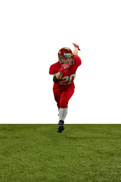 Front view dynamic image of man, american football player in red uniform running on field during game against white background. Professional sport, action, lifestyle, competition, training, ad concept