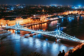 Budapest bridge at night seen from a hill