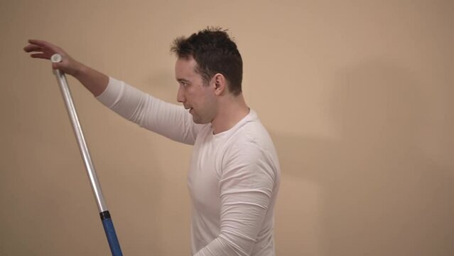 caucasian man in a white t-shirt does exercises on the simulator. slalom kayak. canoeing.side view. High quality Full HD video recording 