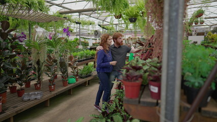 Weekend Shopping for Home Decor at Flower Store by Young Couple. Two Individuals Selecting Plants for New Residence
