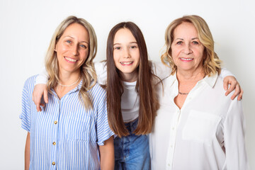 Studio shot of two women. senior Mother, Daughter and little girl