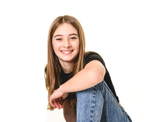 Fototapeta premium Young brunette pre teen girl on studio white
